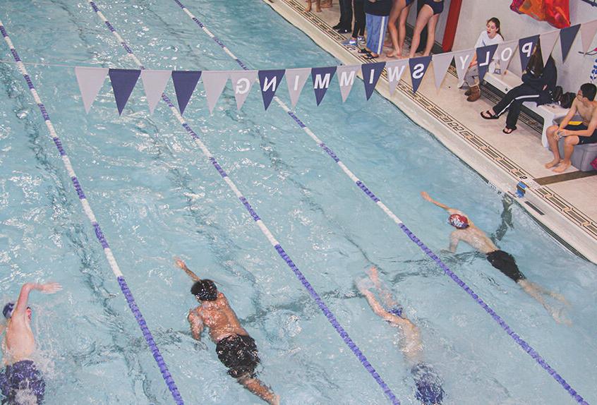 Boy swimmer racing